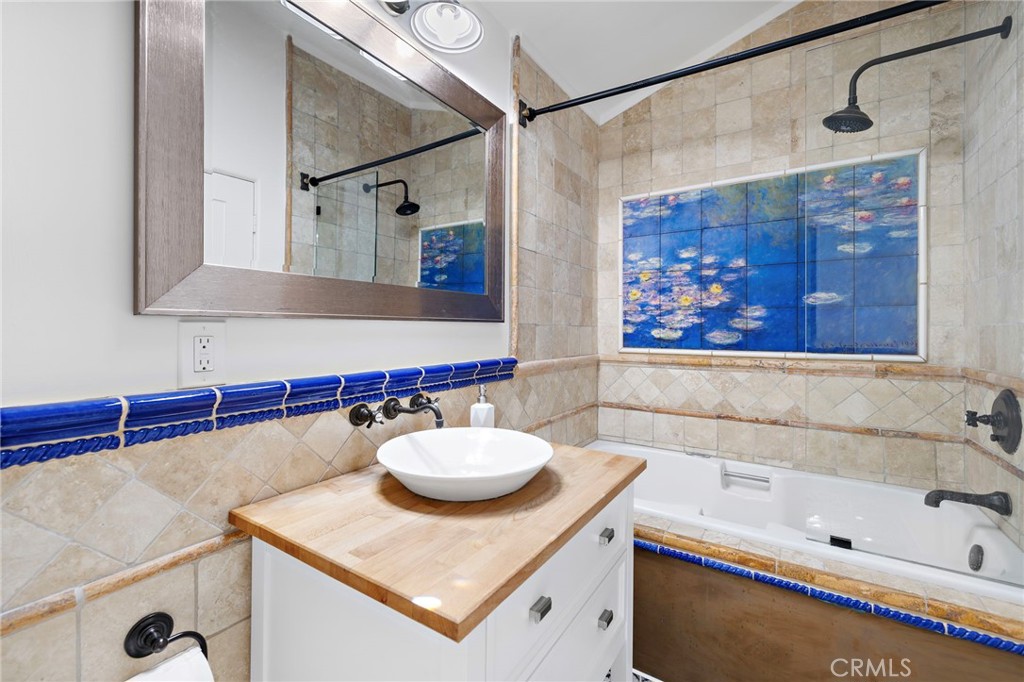 490 Agate Street Laguna Beach, CA 92651 - Photo 22 of 38 a bathroom with a sink and a bathtub