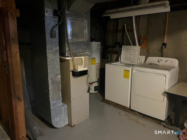 82 River Bend Road, Unit A Stratford, CT 06614 - Photo 5 of 22 a view of storage and utility room with washer and dryer