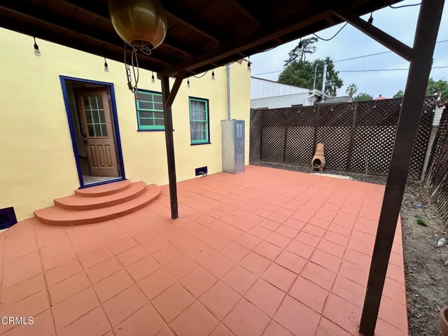 a balcony view with a outdoor seating