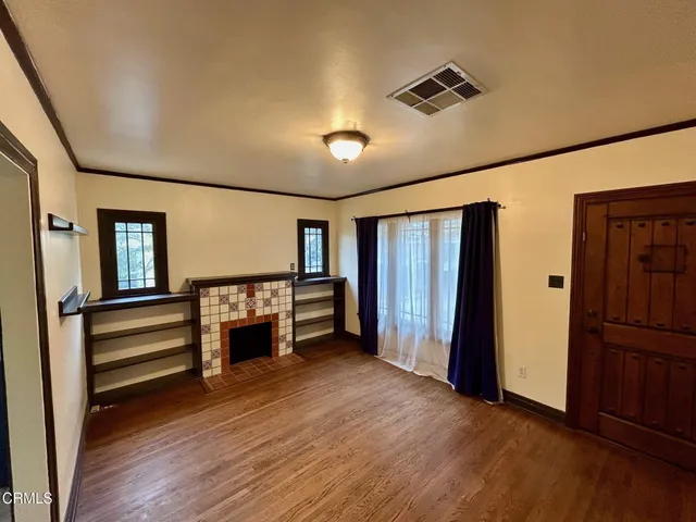 a view of room with furniture and wooden floor