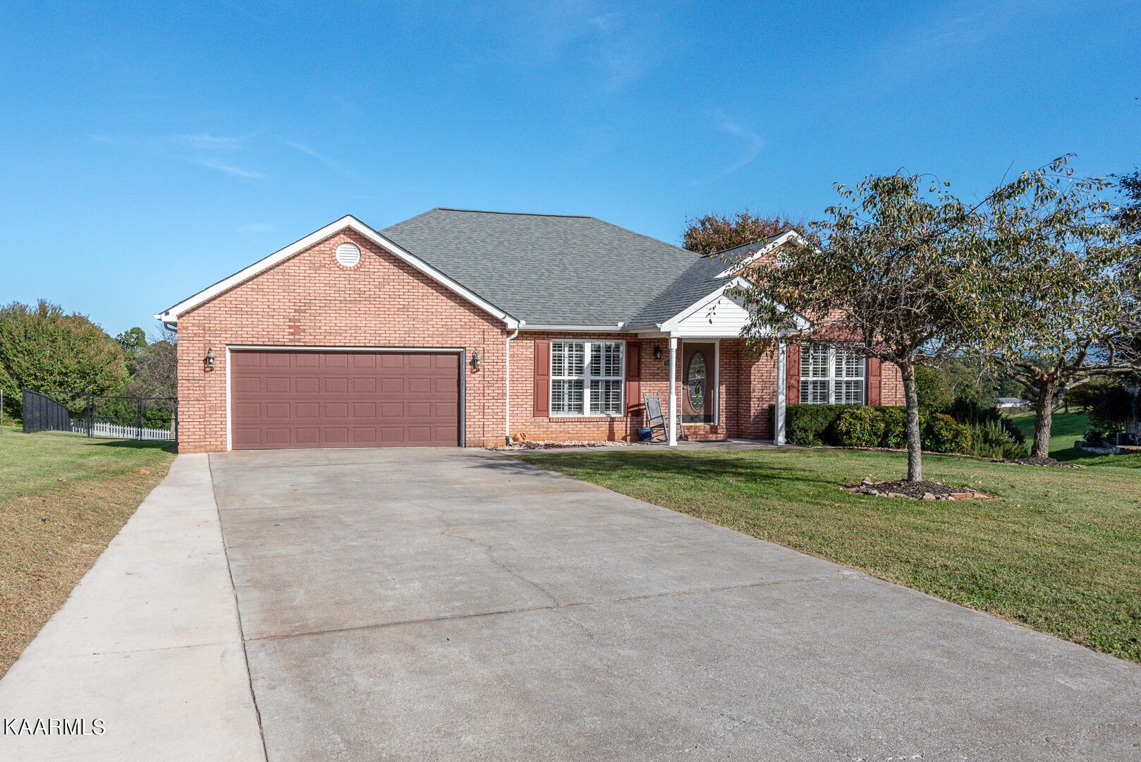 1010 Burton Road Greenback, TN 37742 - Photo 1 of 49 a view of a house with a yard and garage
