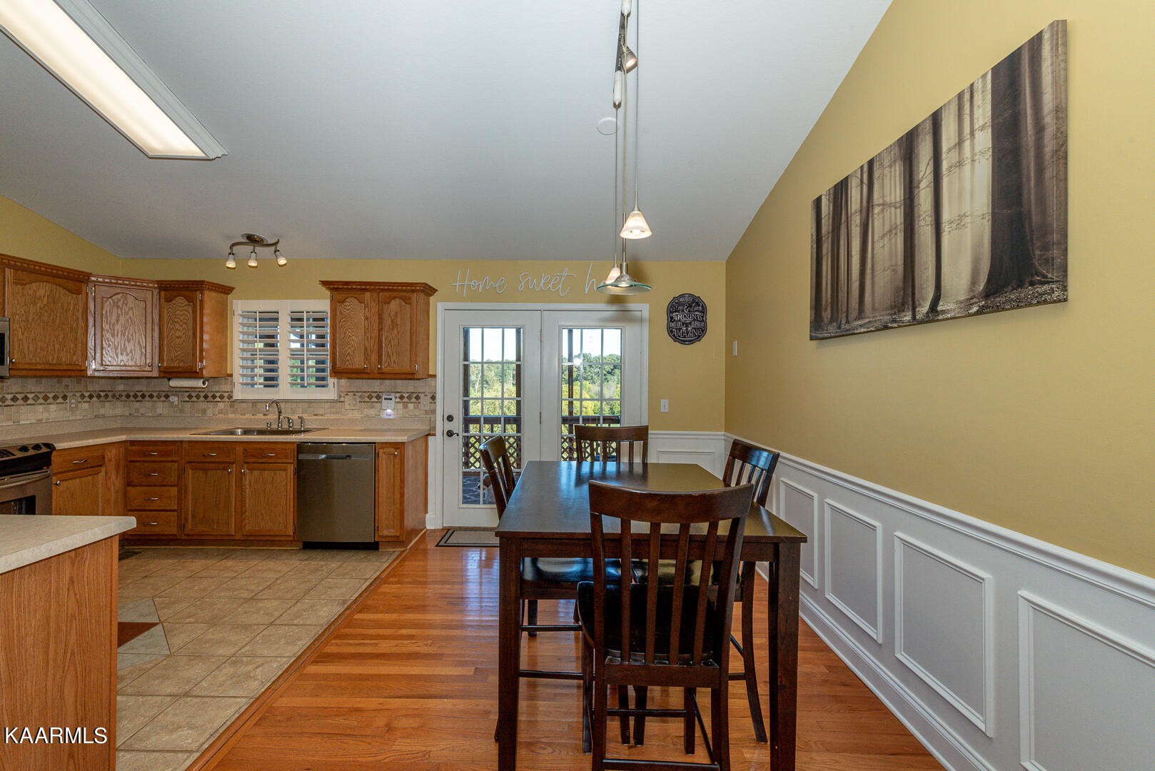 1010 Burton Road Greenback, TN 37742 - Photo 12 of 49 a kitchen with stainless steel appliances granite countertop a kitchen island a stove a dining table and chairs