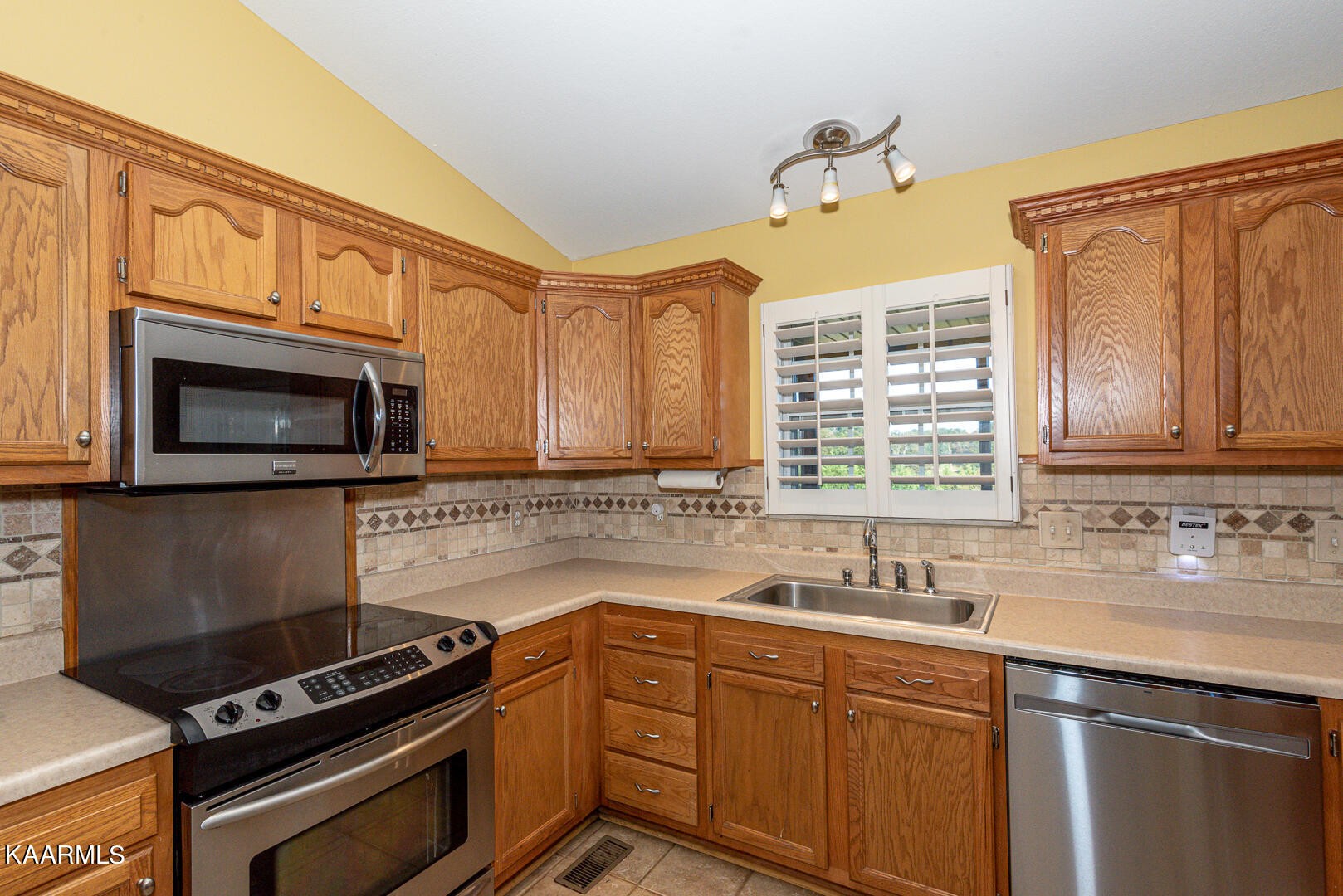 1010 Burton Road Greenback, TN 37742 - Photo 15 of 49 a kitchen with a sink stove top oven and microwave