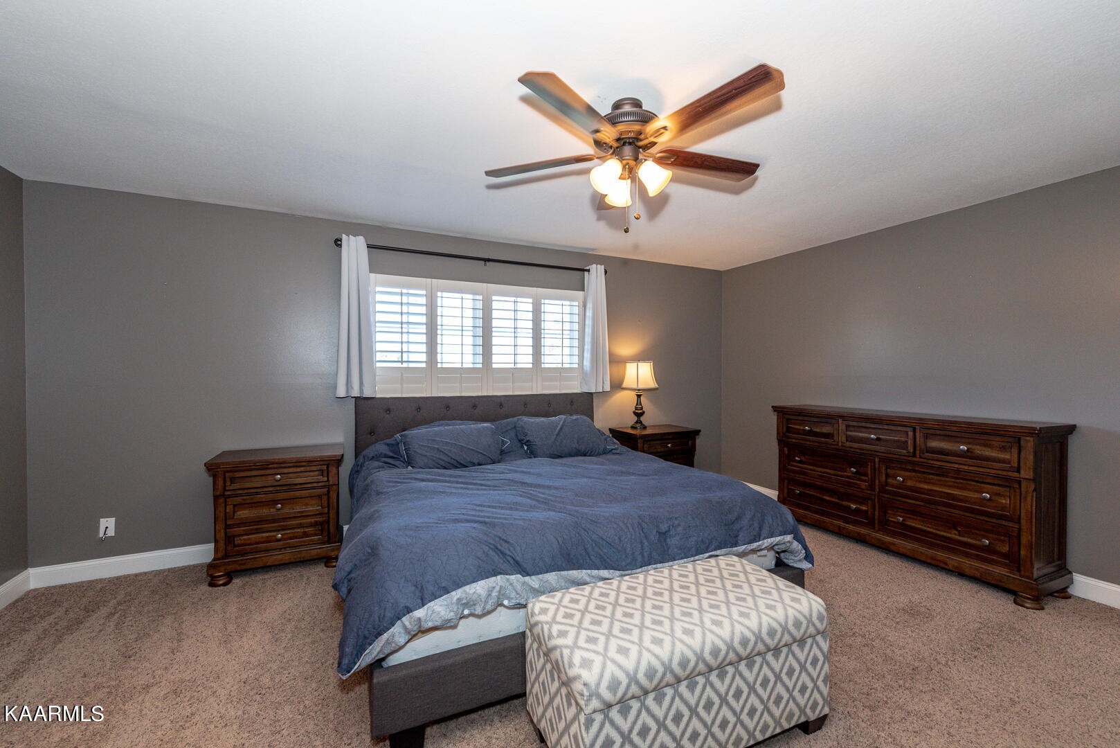 1010 Burton Road Greenback, TN 37742 - Photo 17 of 49 a bedroom with a bed and a chandelier