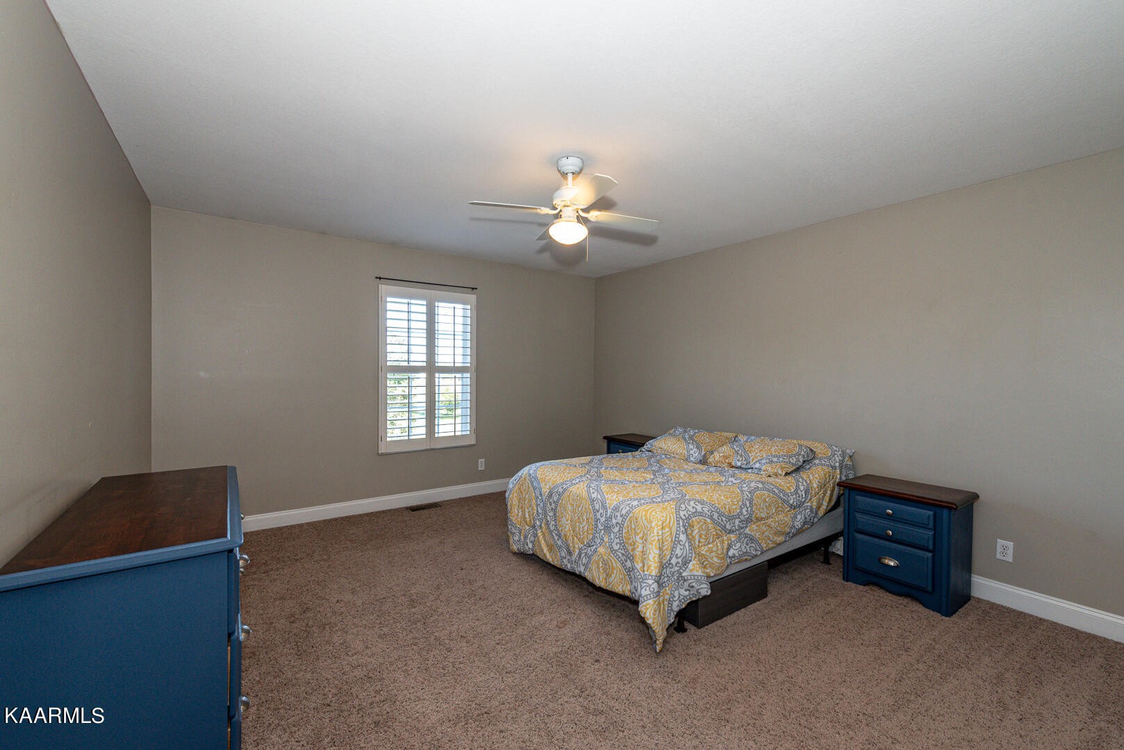 1010 Burton Road Greenback, TN 37742 - Photo 20 of 49 a spacious bedroom with a bed and a chandelier