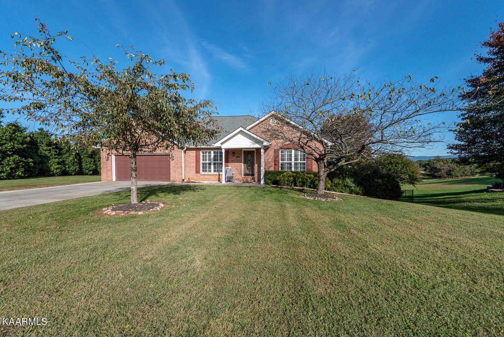 1010 Burton Road Greenback, TN 37742 - Photo 2 of 49 a front view of a house with a garden