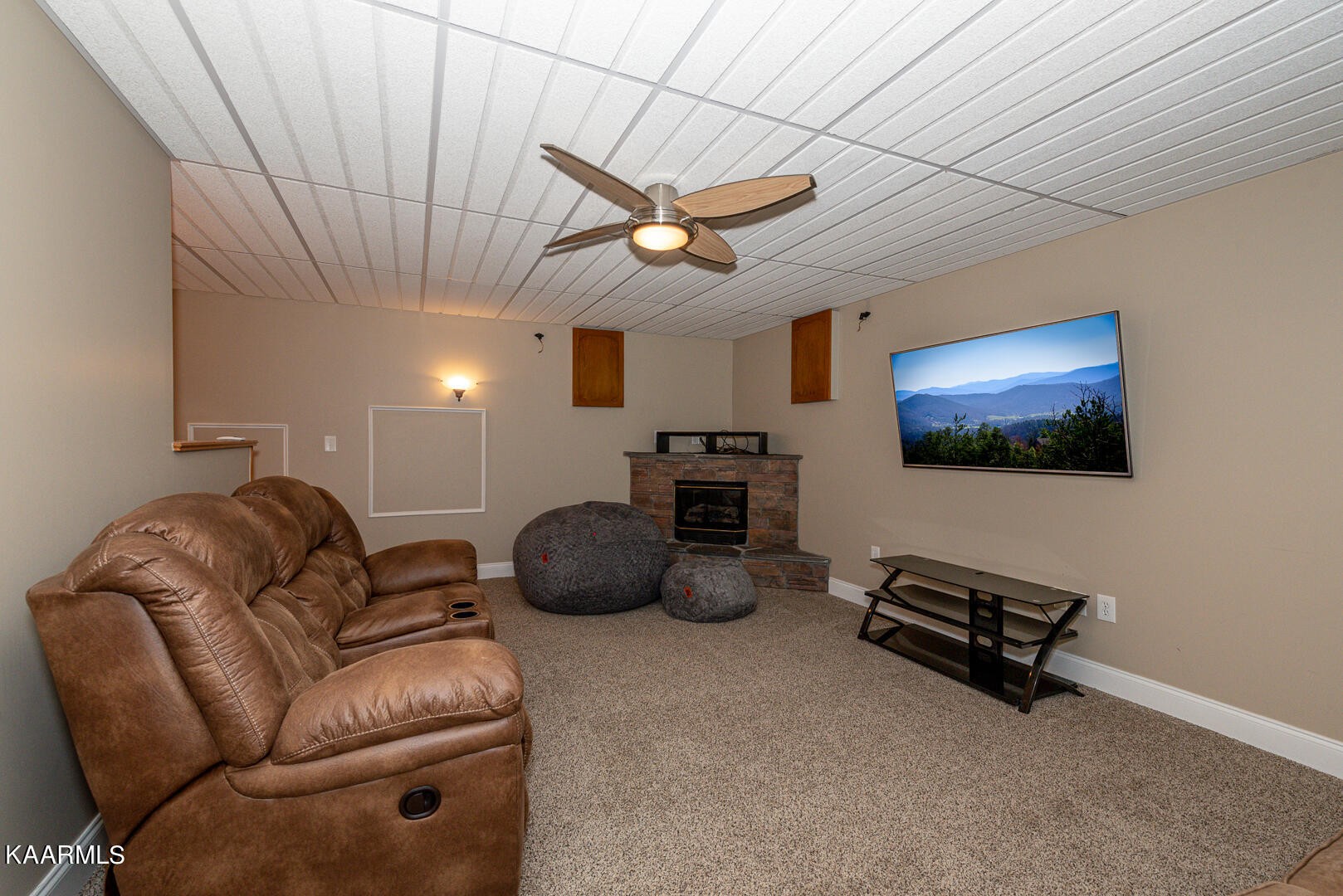 1010 Burton Road Greenback, TN 37742 - Photo 40 of 49 a living room with furniture a ceiling fan and a rug