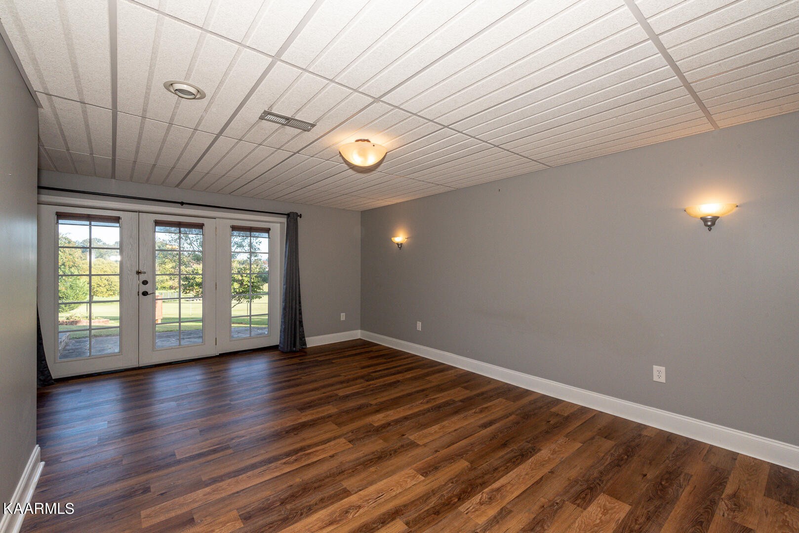 1010 Burton Road Greenback, TN 37742 - Photo 41 of 49 a view of an empty room with wooden floor and a window