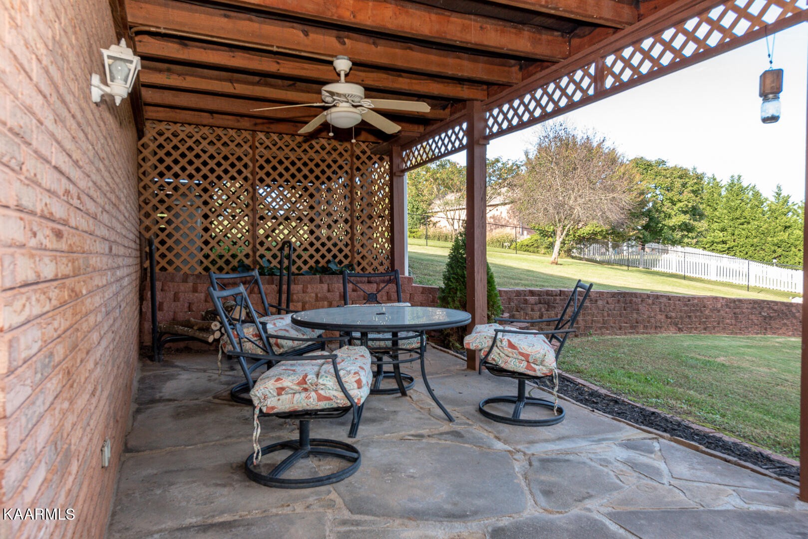 1010 Burton Road Greenback, TN 37742 - Photo 48 of 49 a view of a patio with table and chairs with wooden floor and fence
