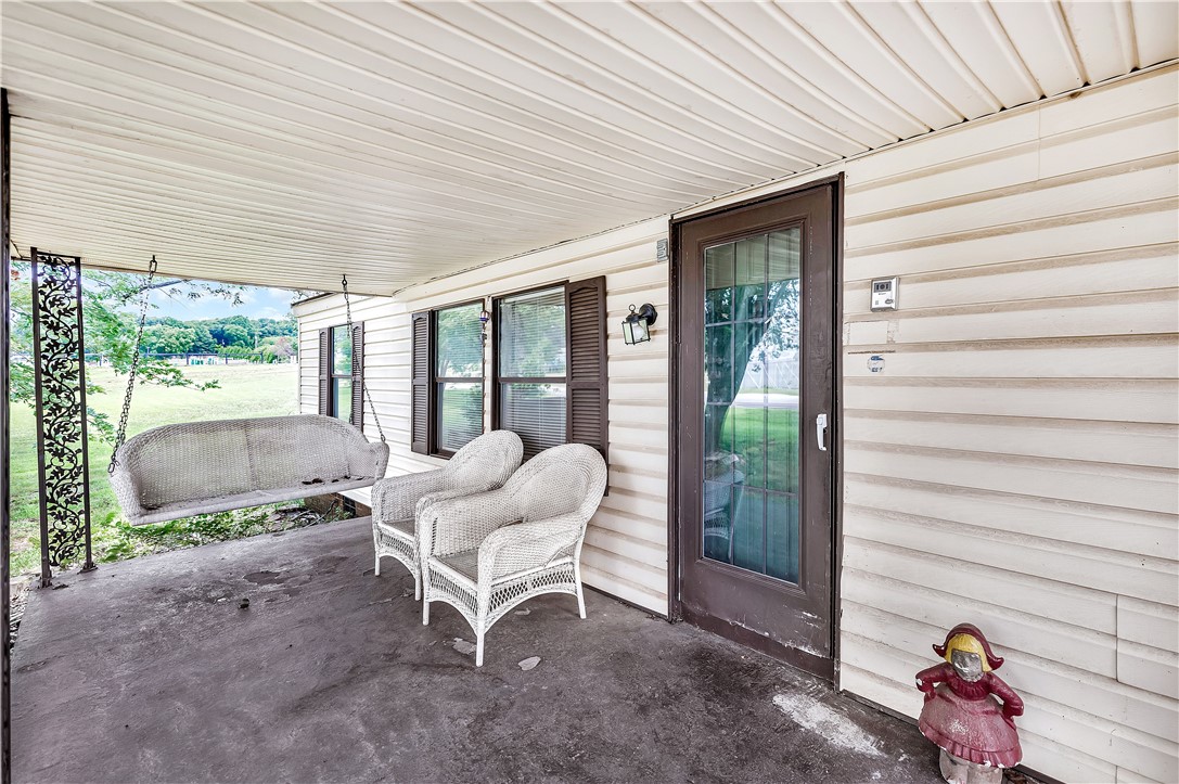 1004 Wiles Road Anderson, SC 29625 - Photo 2 of 26 Relax outdoors on this covered front porch with a charming porch swing and scenic views.