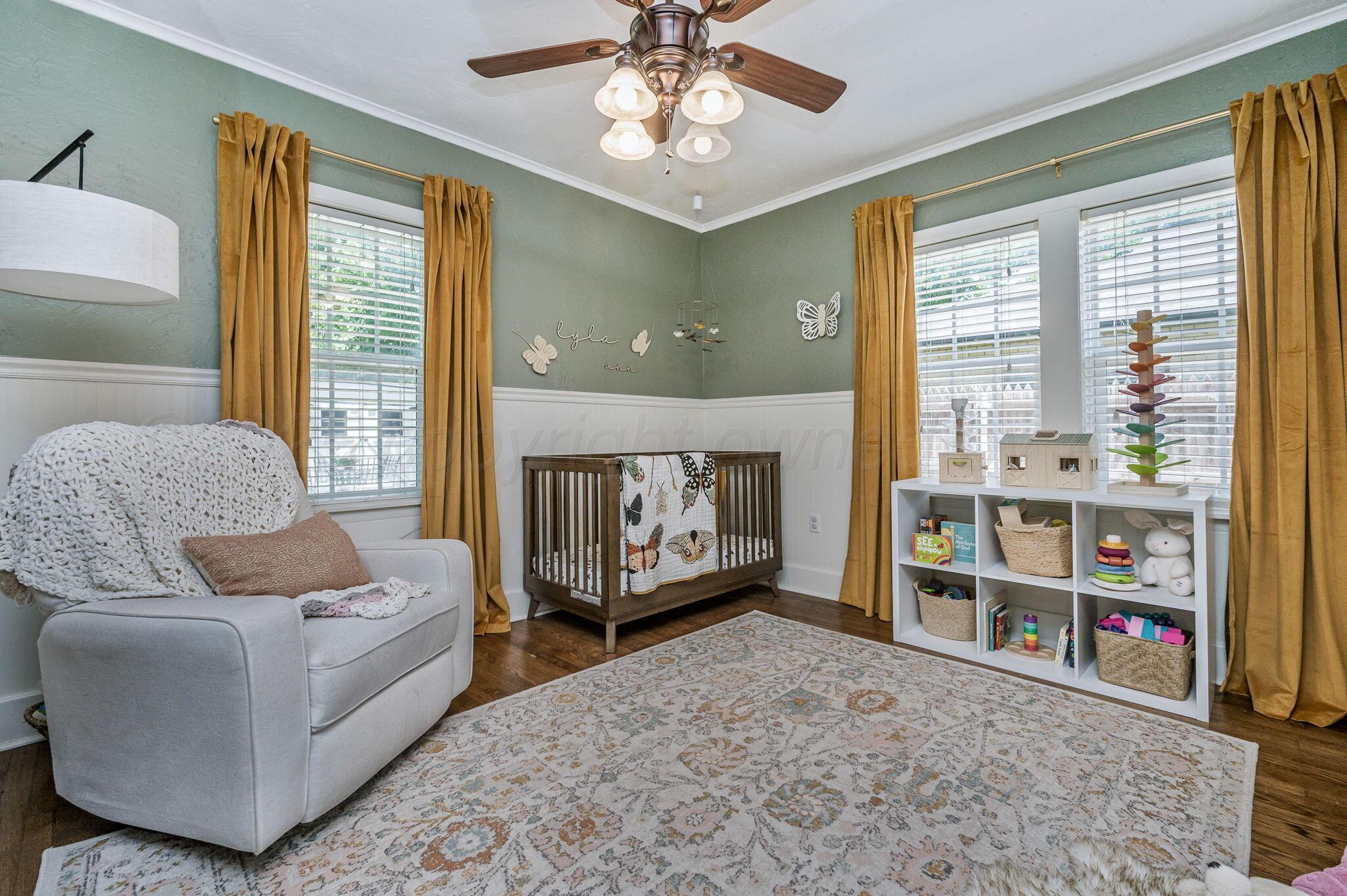 501 Sunset Terrace Amarillo, TX 79106 - Photo 13 of 21 a living room with furniture a flat screen tv and a large window