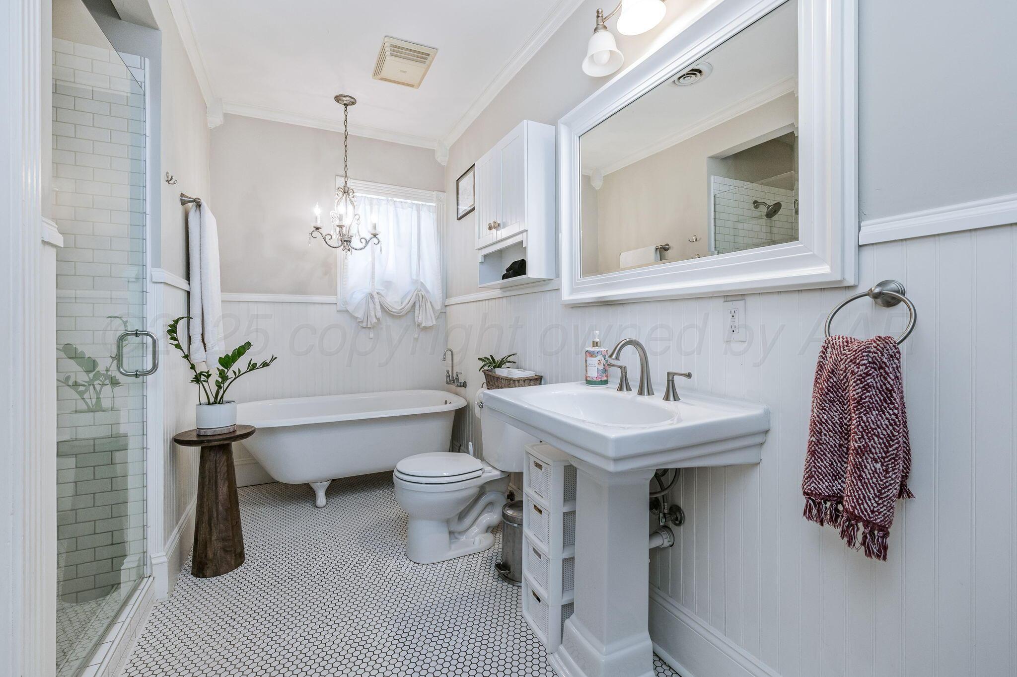 501 Sunset Terrace Amarillo, TX 79106 - Photo 15 of 21 a bathroom with a sink toilet a mirror and vanity