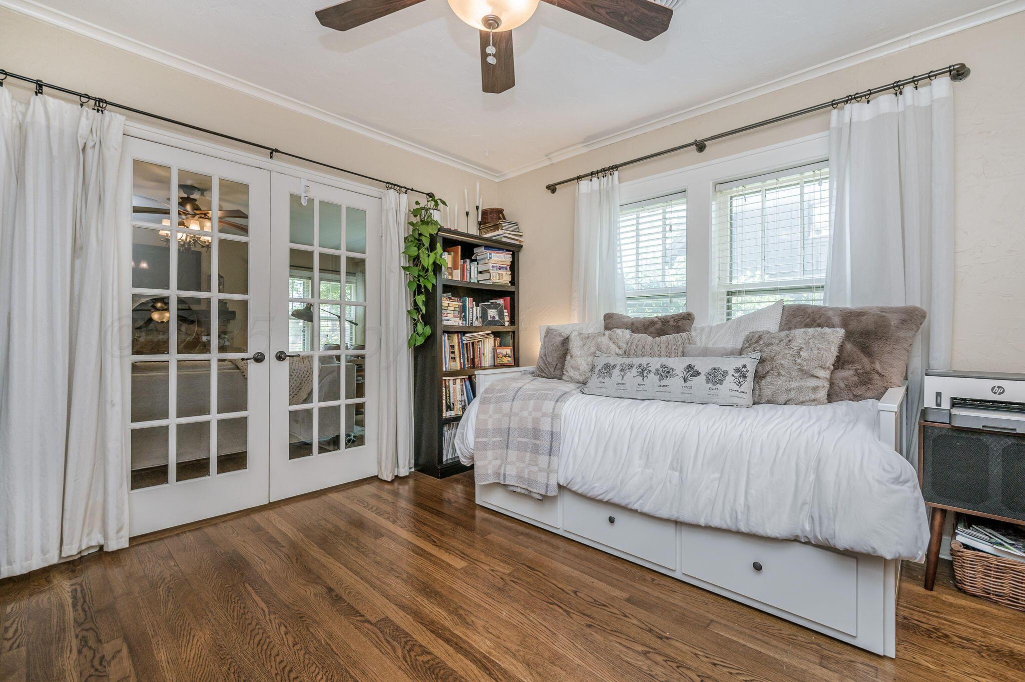 501 Sunset Terrace Amarillo, TX 79106 - Photo 18 of 21 a bedroom with a large bed and a window