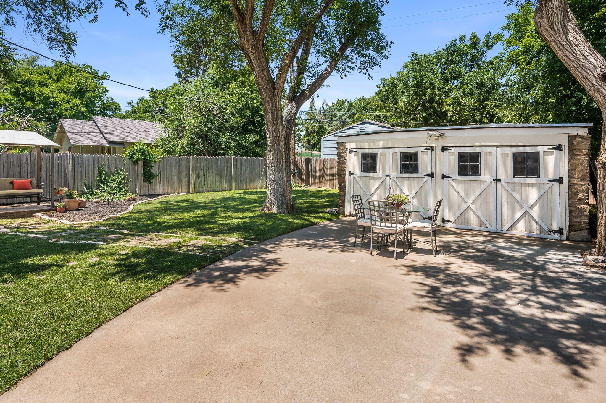 501 Sunset Terrace Amarillo, TX 79106 - Photo 20 of 21 a front view of a house with a yard outdoor seating and pathway