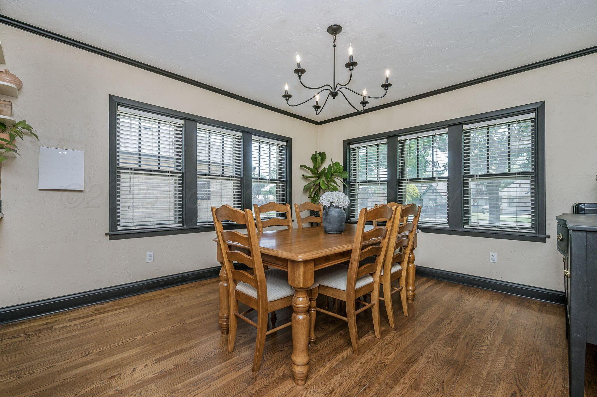 501 Sunset Terrace Amarillo, TX 79106 - Photo 6 of 21 a view of a dining room with furniture window and wooden floor
