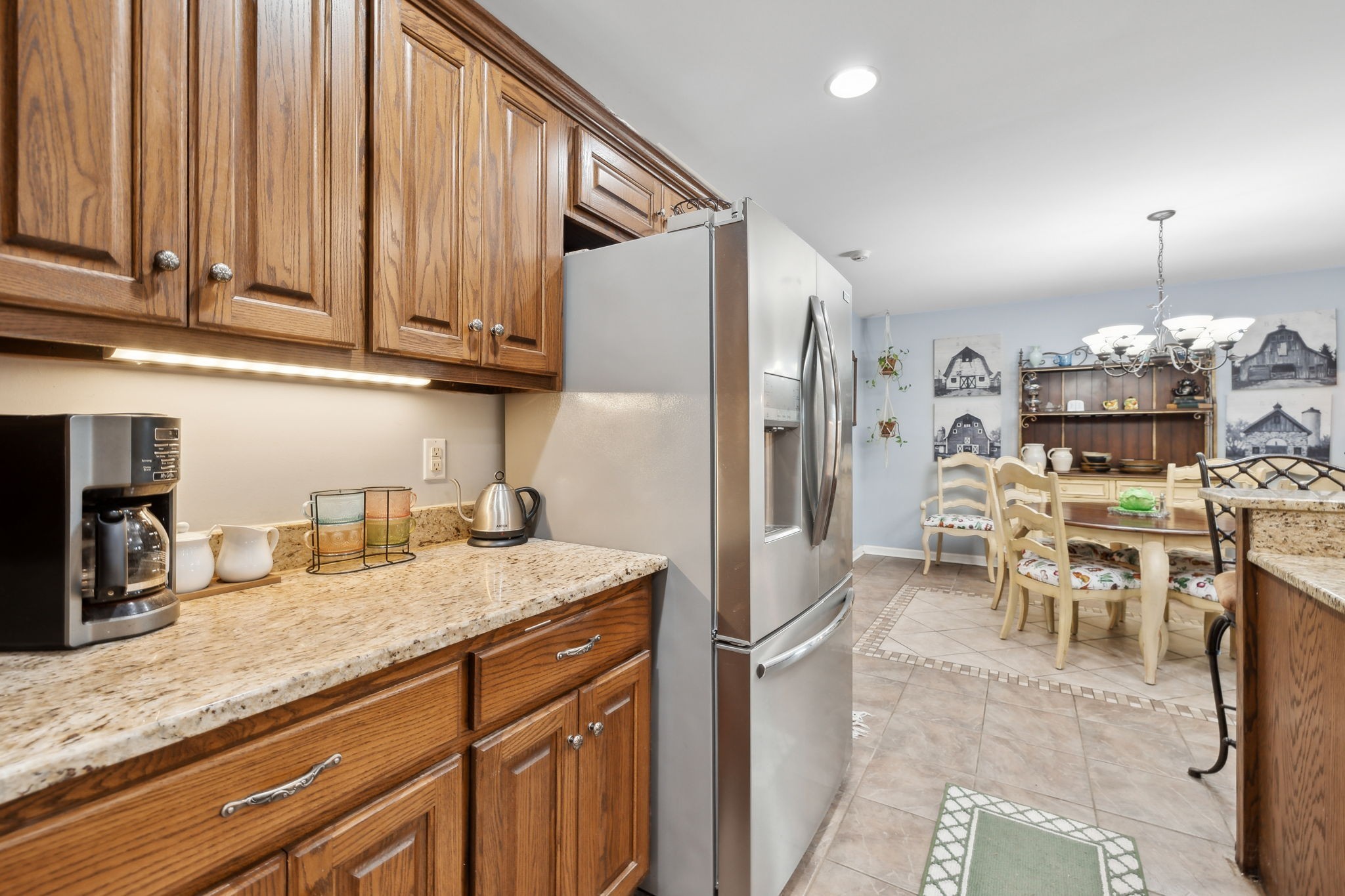 1550 Beech Bottom Road Watertown, TN 37184 - Photo 12 of 38 a kitchen with granite countertop a refrigerator a stove a sink and chairs