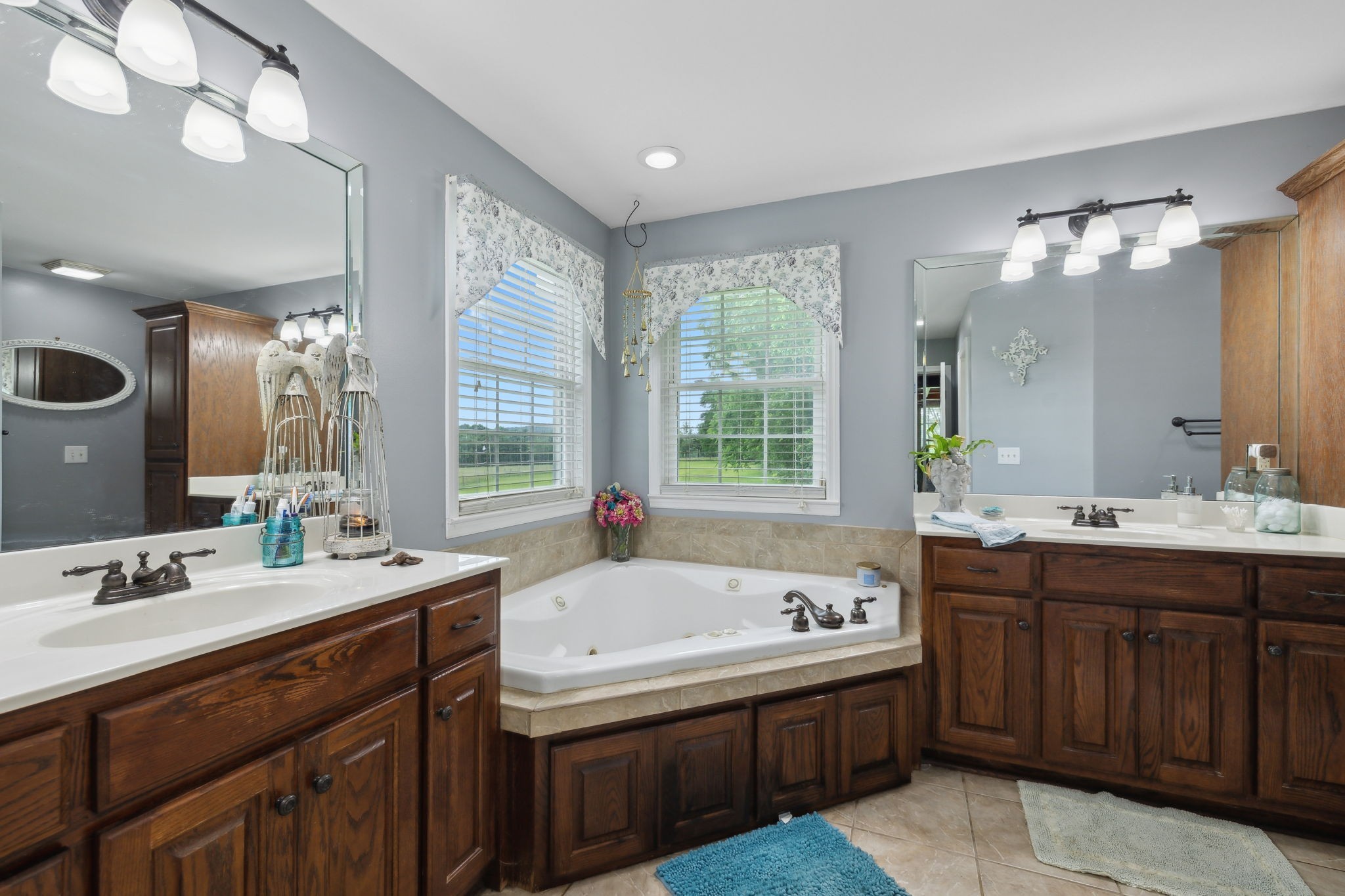 1550 Beech Bottom Road Watertown, TN 37184 - Photo 19 of 38 a bathroom with a tub sink and mirror