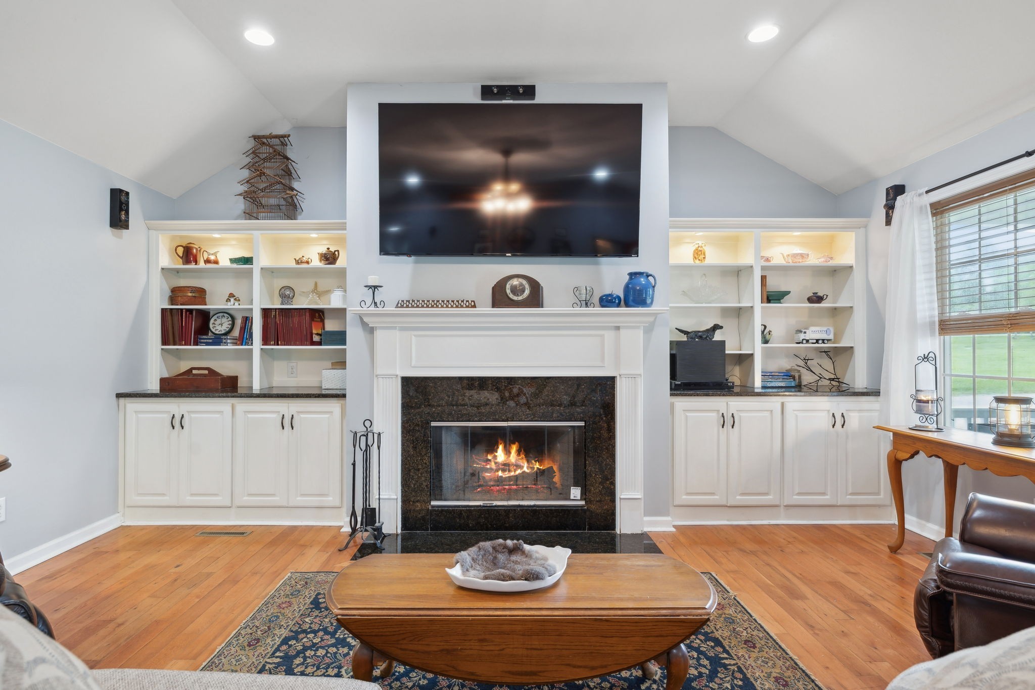 1550 Beech Bottom Road Watertown, TN 37184 - Photo 6 of 38 a living room with furniture a flat screen tv and a fireplace
