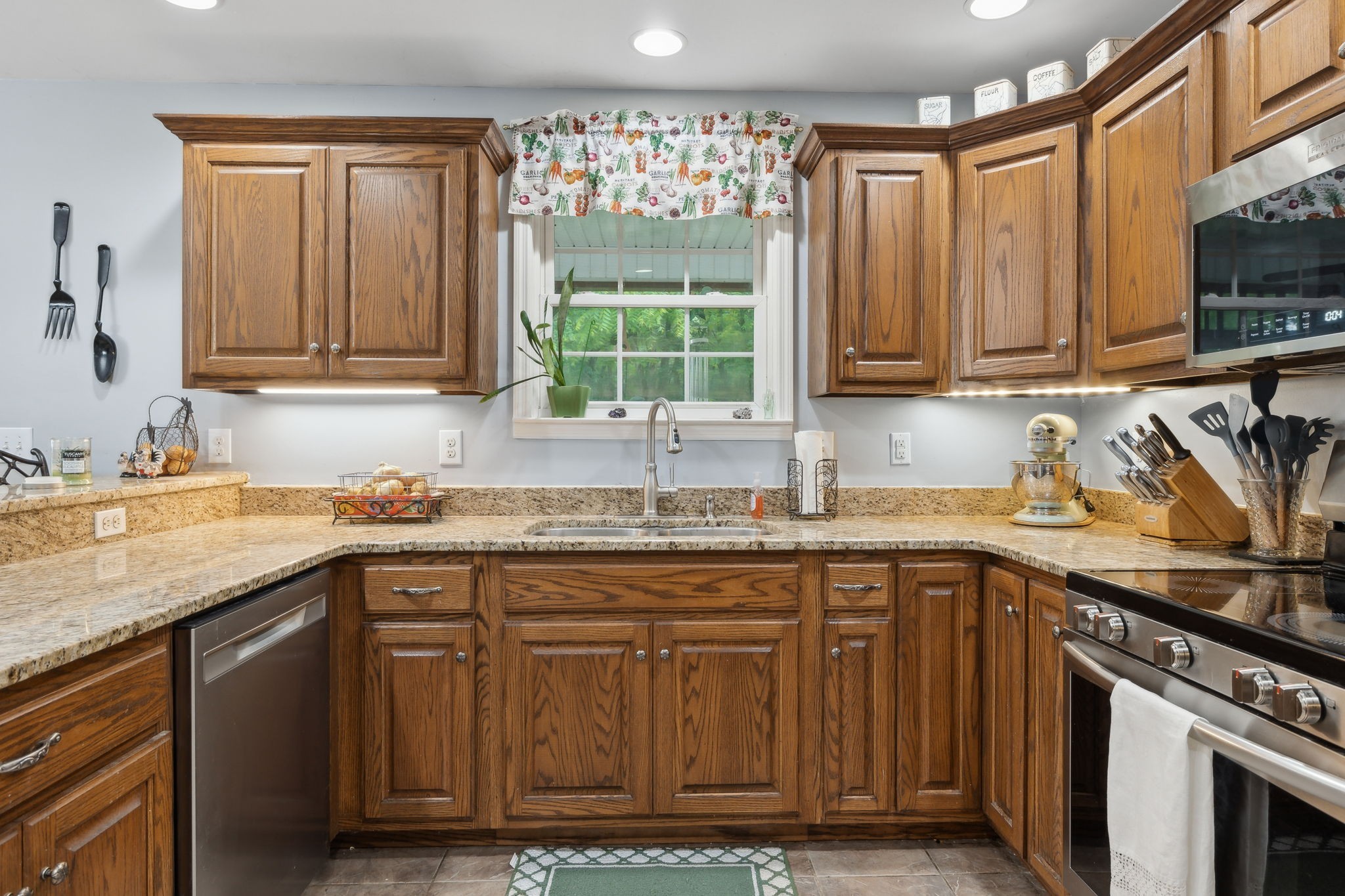1550 Beech Bottom Road Watertown, TN 37184 - Photo 9 of 38 a kitchen with granite countertop a sink stainless steel appliances and cabinets