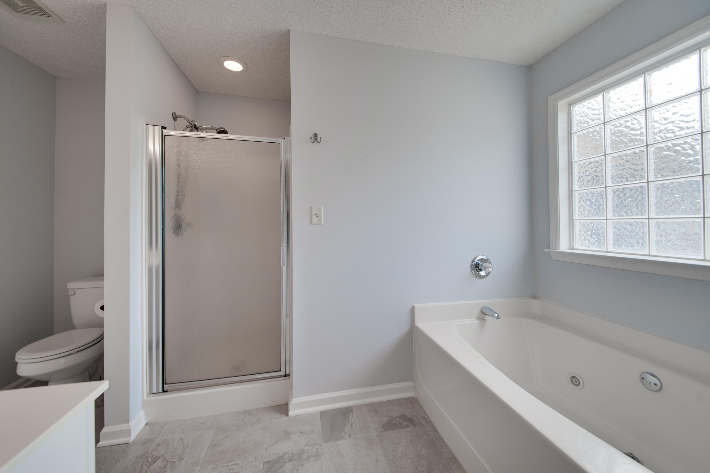 8 Chappells Road Aiken, SC 29803 - Photo 8 of 15 a bathroom with a bathtub and a toilet
