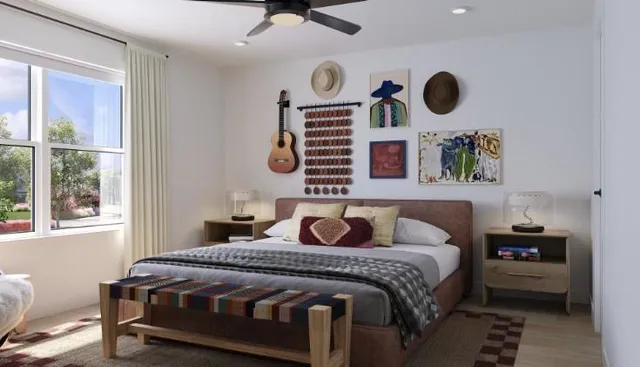 a bedroom with a bed a mirror and a window