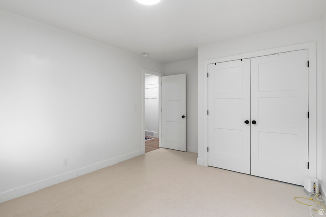 4150 Dover Lane Provo, UT 84604 - Photo 22 of 44 Neutral tone carpeting with white baseboards