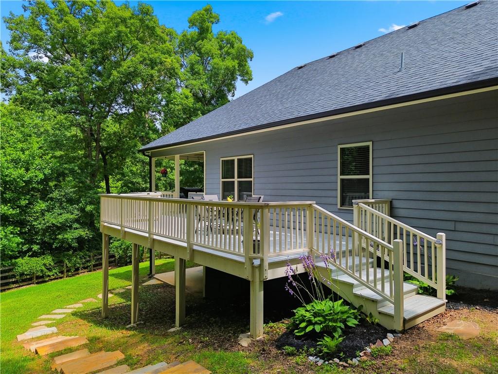 302 Spence Circle Ball Ground, GA 30107 - Photo 45 of 55 a view of a chair and table in the deck