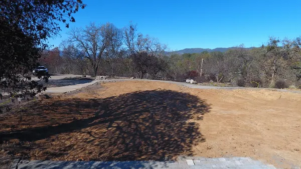 a view of a yard with mountain view