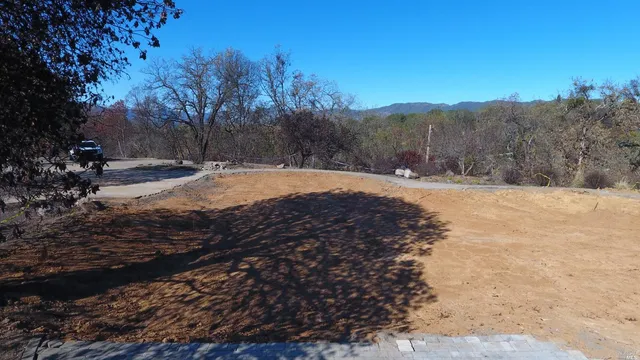 a view of a yard with mountain view