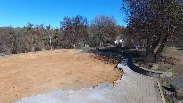 a view of a backyard of the house