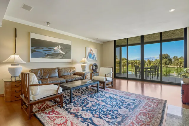 a living room with furniture and a rug