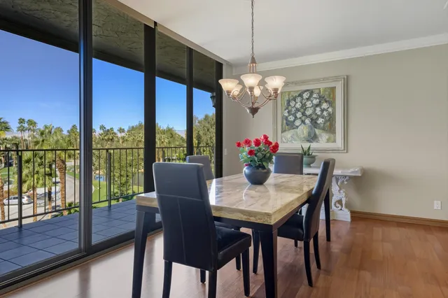a view of a dining room with furniture window and outside view