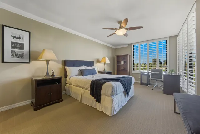 a bedroom with a bed and a table