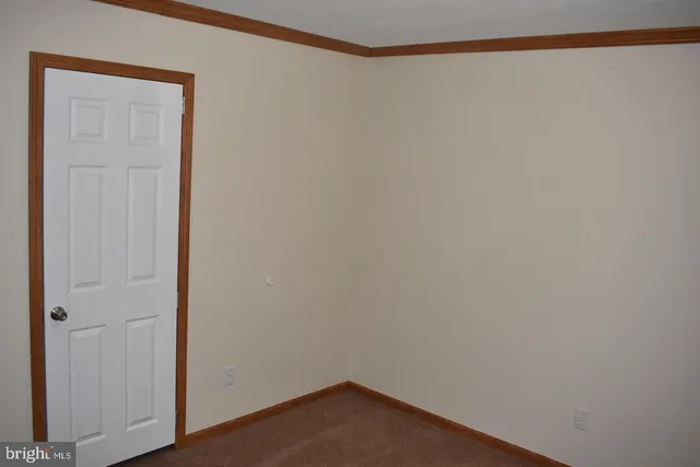 a room with a bed and a window