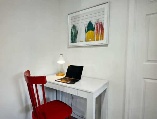 a view of a workspace with furniture