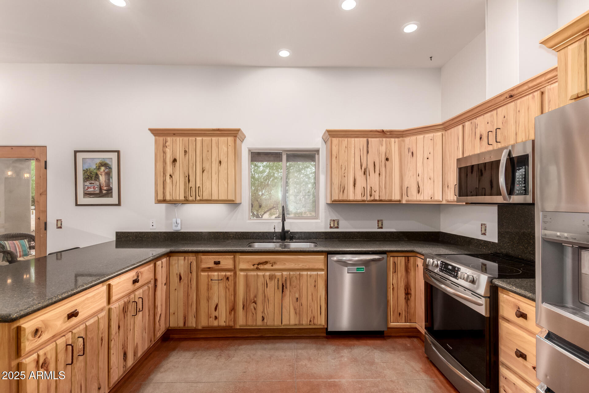 40342 North 253rd Avenue Morristown, AZ 85342 - Photo 14 of 73 a large kitchen with stainless steel appliances granite countertop a stove and a sink