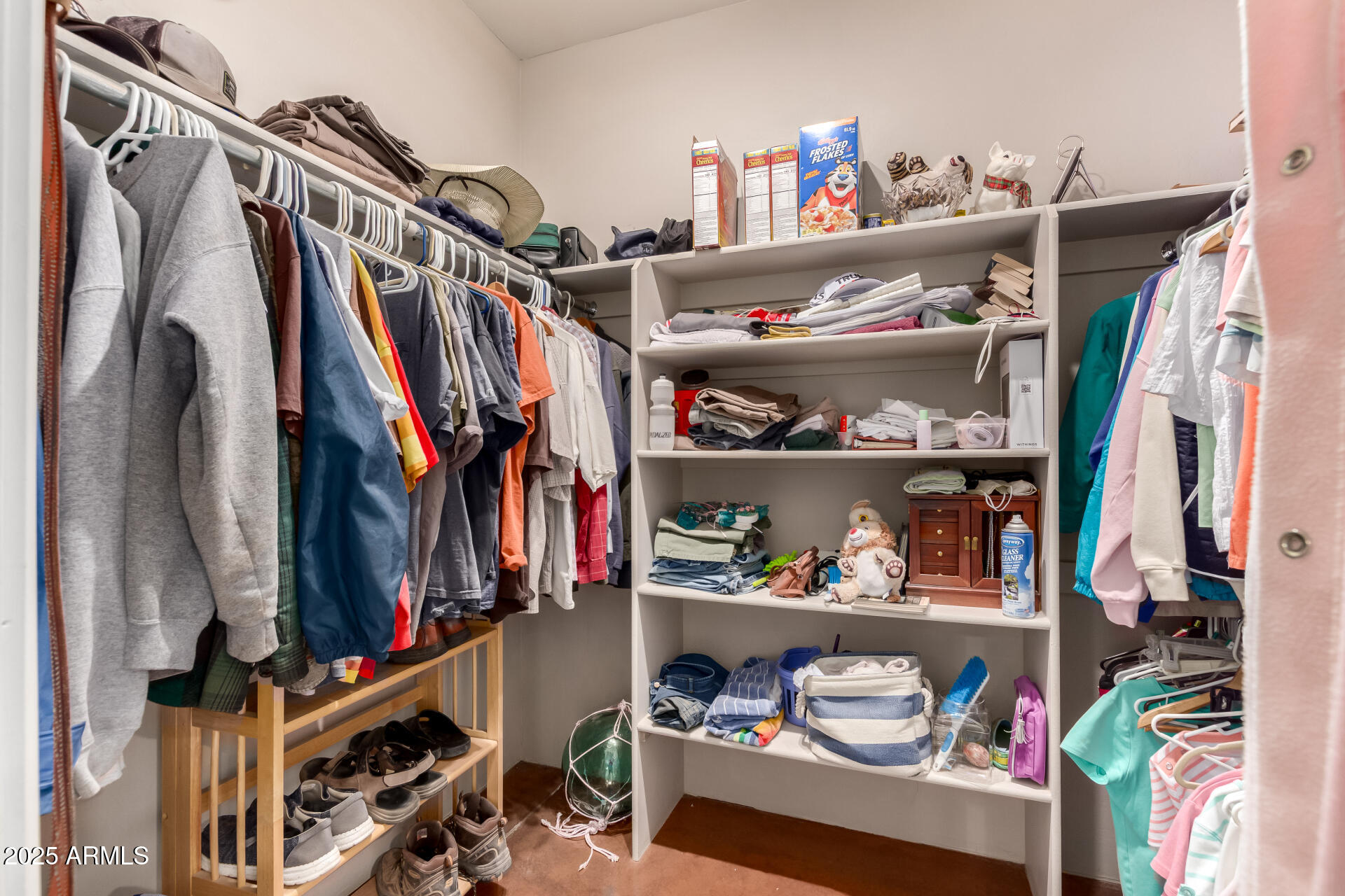40342 North 253rd Avenue Morristown, AZ 85342 - Photo 21 of 73 a view of walk in closet with clothes and shoes