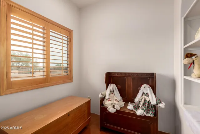 a room with furniture and gym equipment