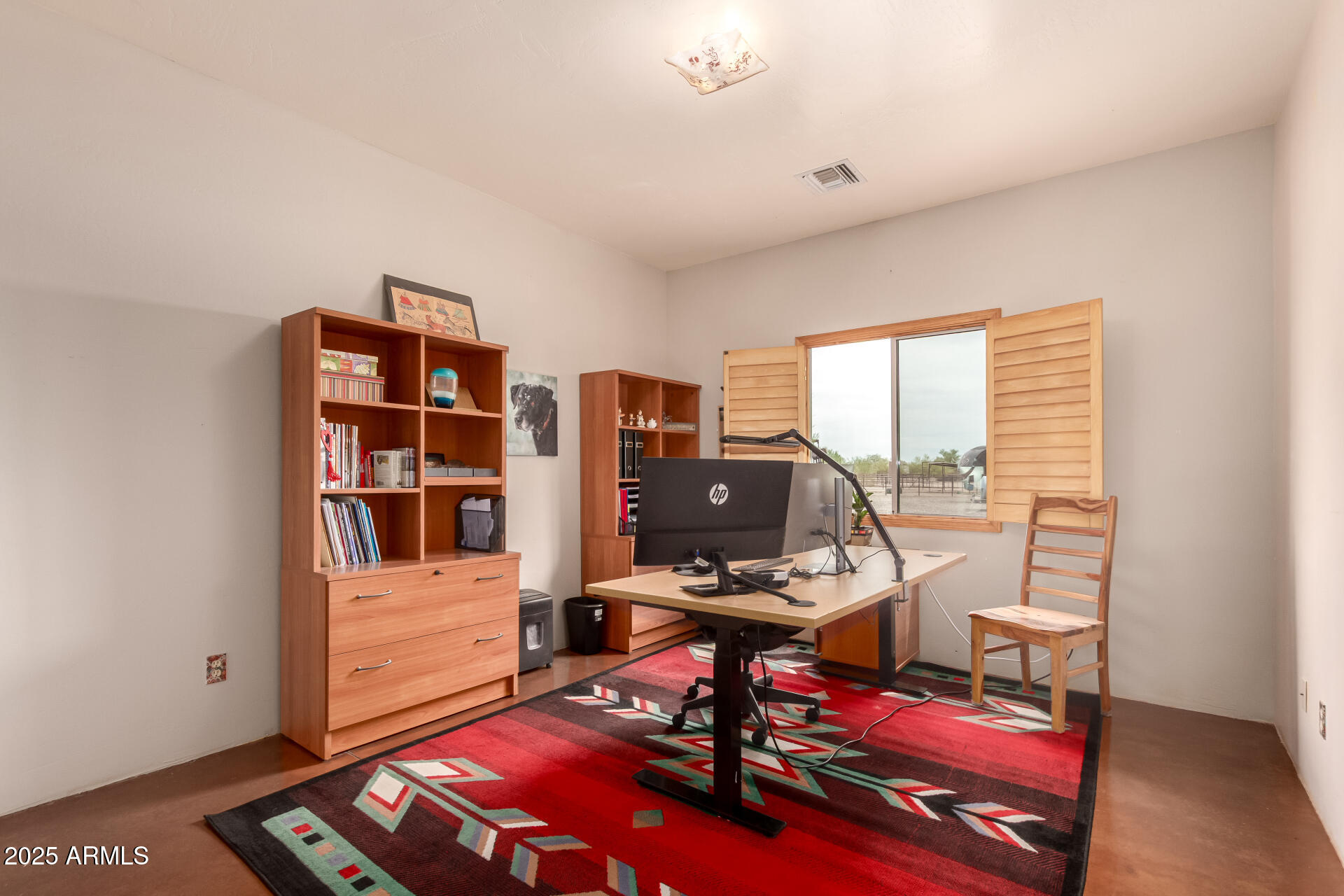 40342 North 253rd Avenue Morristown, AZ 85342 - Photo 27 of 73 a view of a workspace with furniture and a window