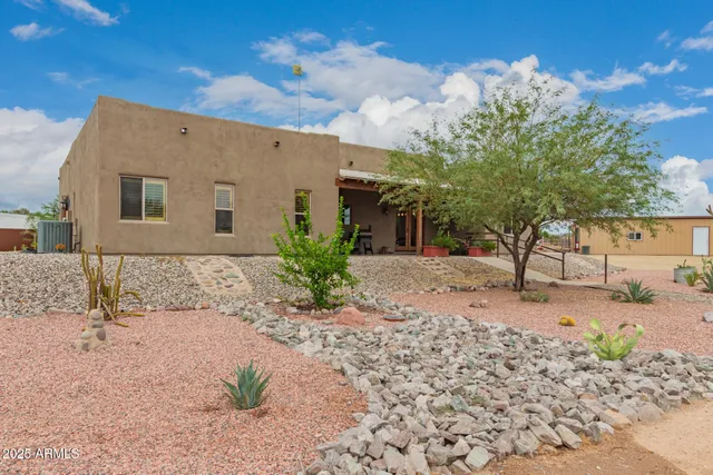 a living room with furniture a rug and a fireplace