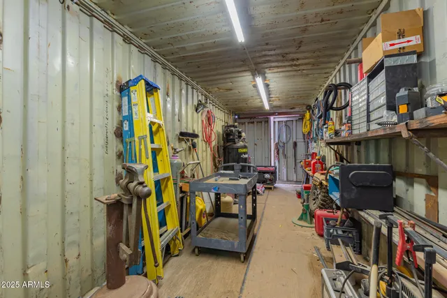 an aerial view of a house with a yard and sitting area