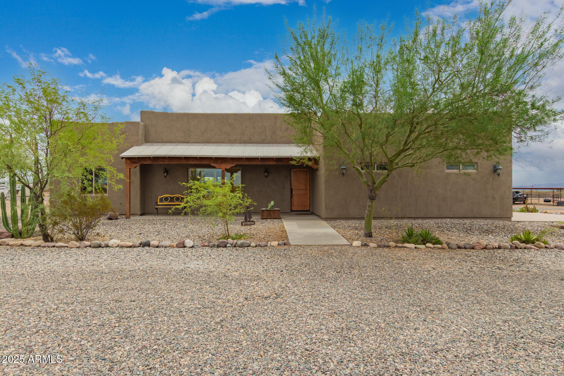 40342 North 253rd Avenue Morristown, AZ 85342 - Photo 43 of 73 a front view of a house with a yard and garage