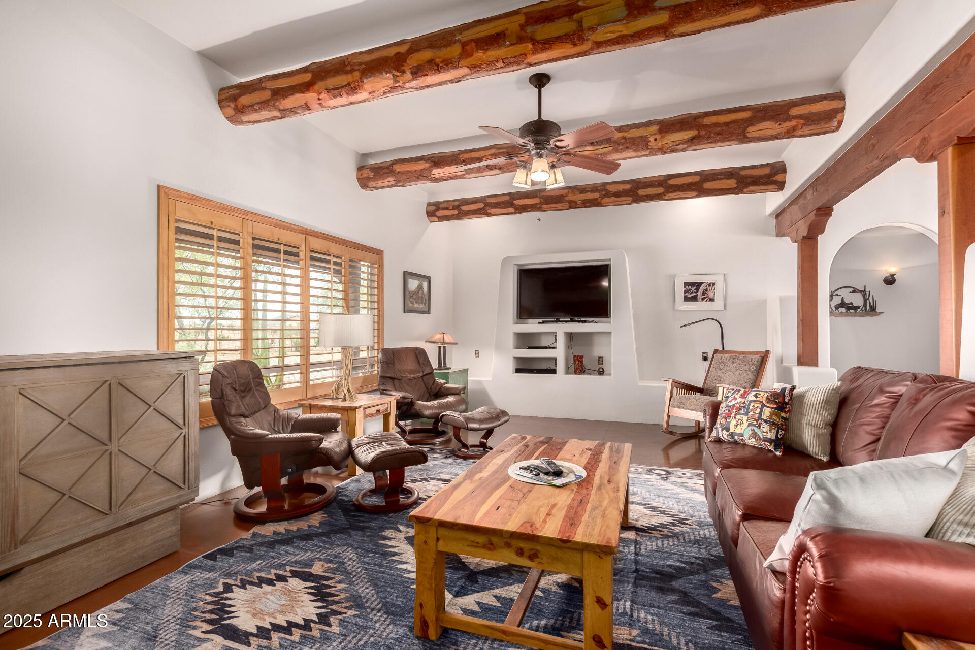 40342 North 253rd Avenue Morristown, AZ 85342 - Photo 7 of 73 a living room with furniture a rug and a fireplace
