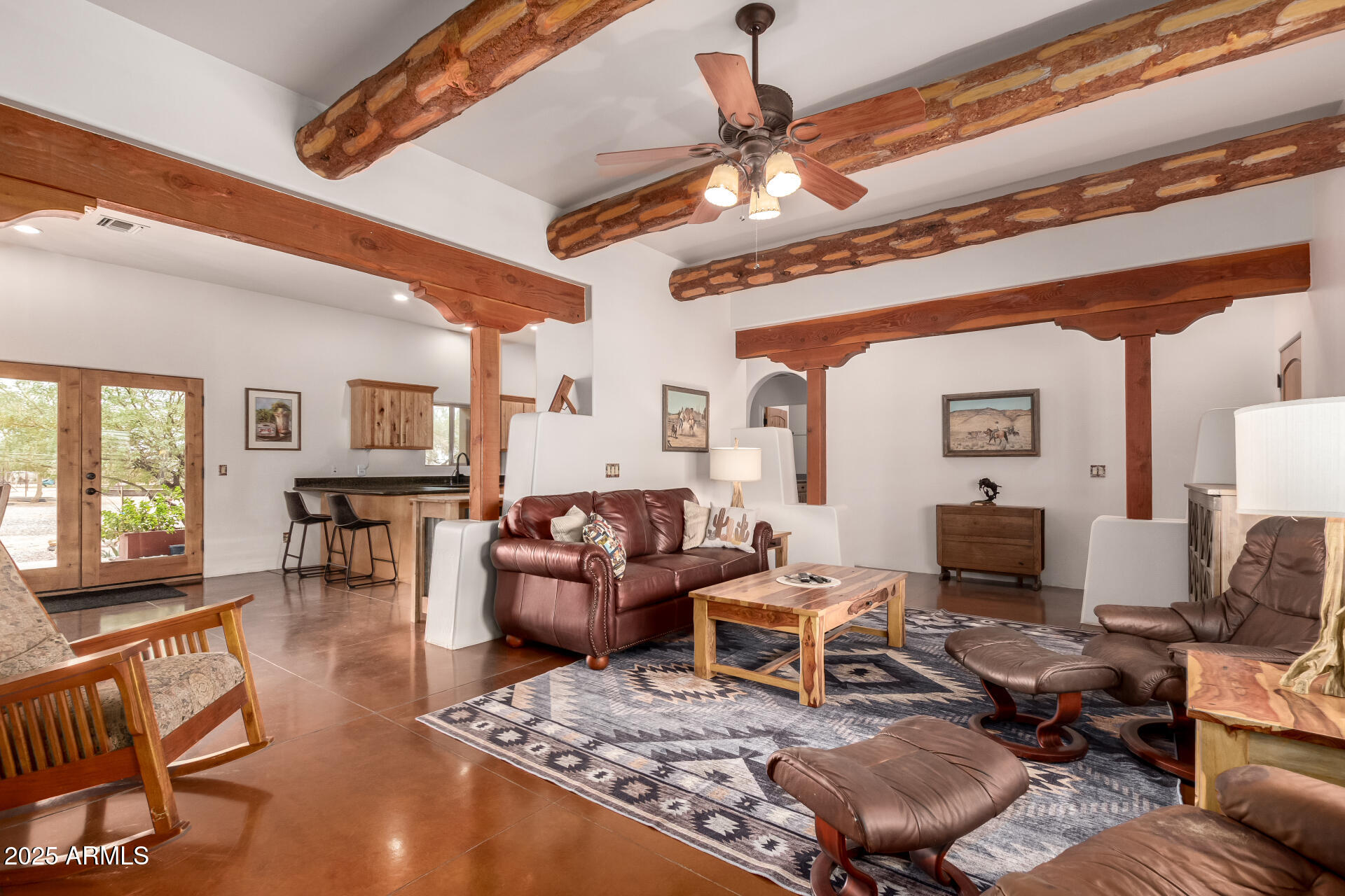 40342 North 253rd Avenue Morristown, AZ 85342 - Photo 8 of 73 a living room with furniture and a fireplace