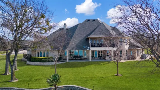 a view of house with a yard