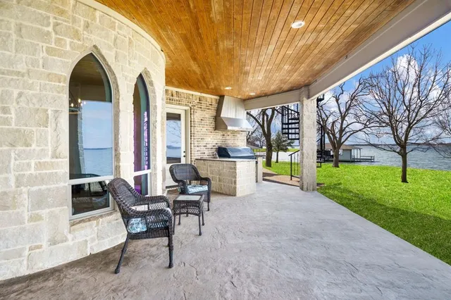 a building outdoor space with patio furniture and garden