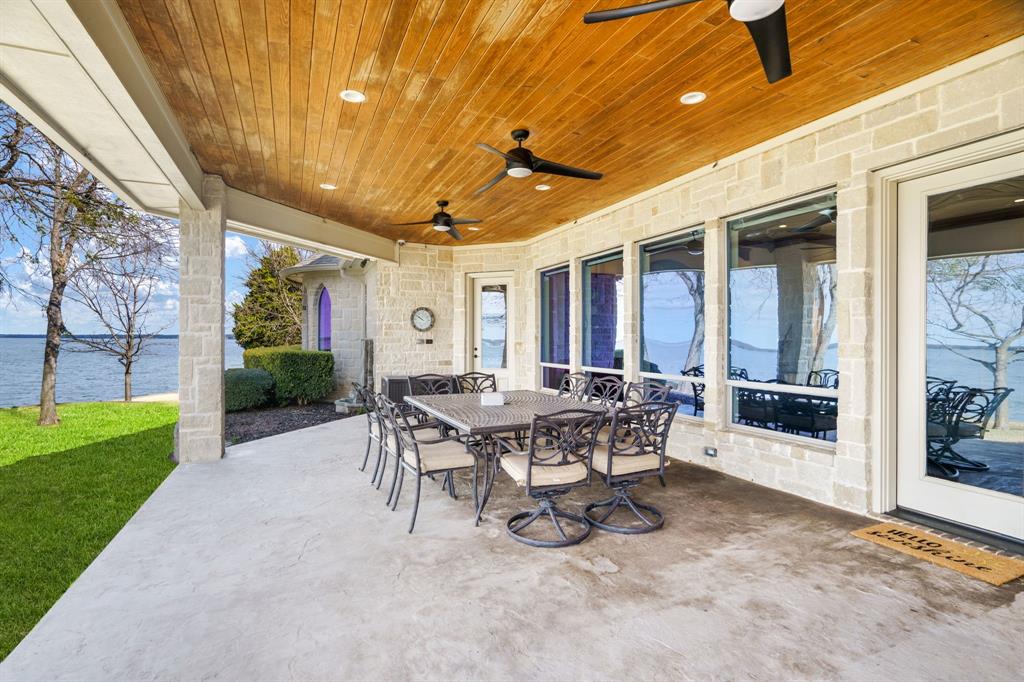 507 Chambers Point Drive Kerens, TX 75144 - Photo 36 of 39 a view of a patio with table and chairs and potted plants