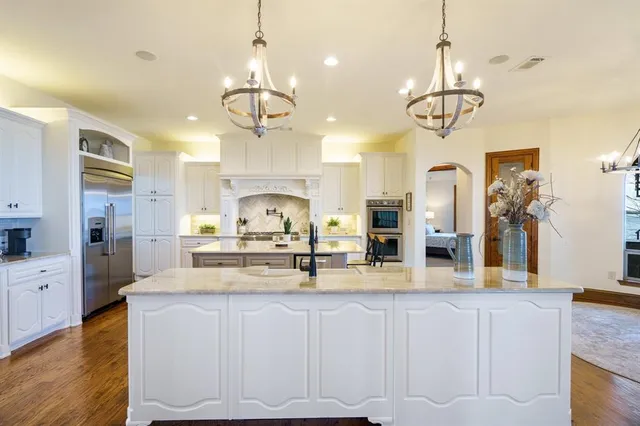 a kitchen with a counter space cabinets and appliances