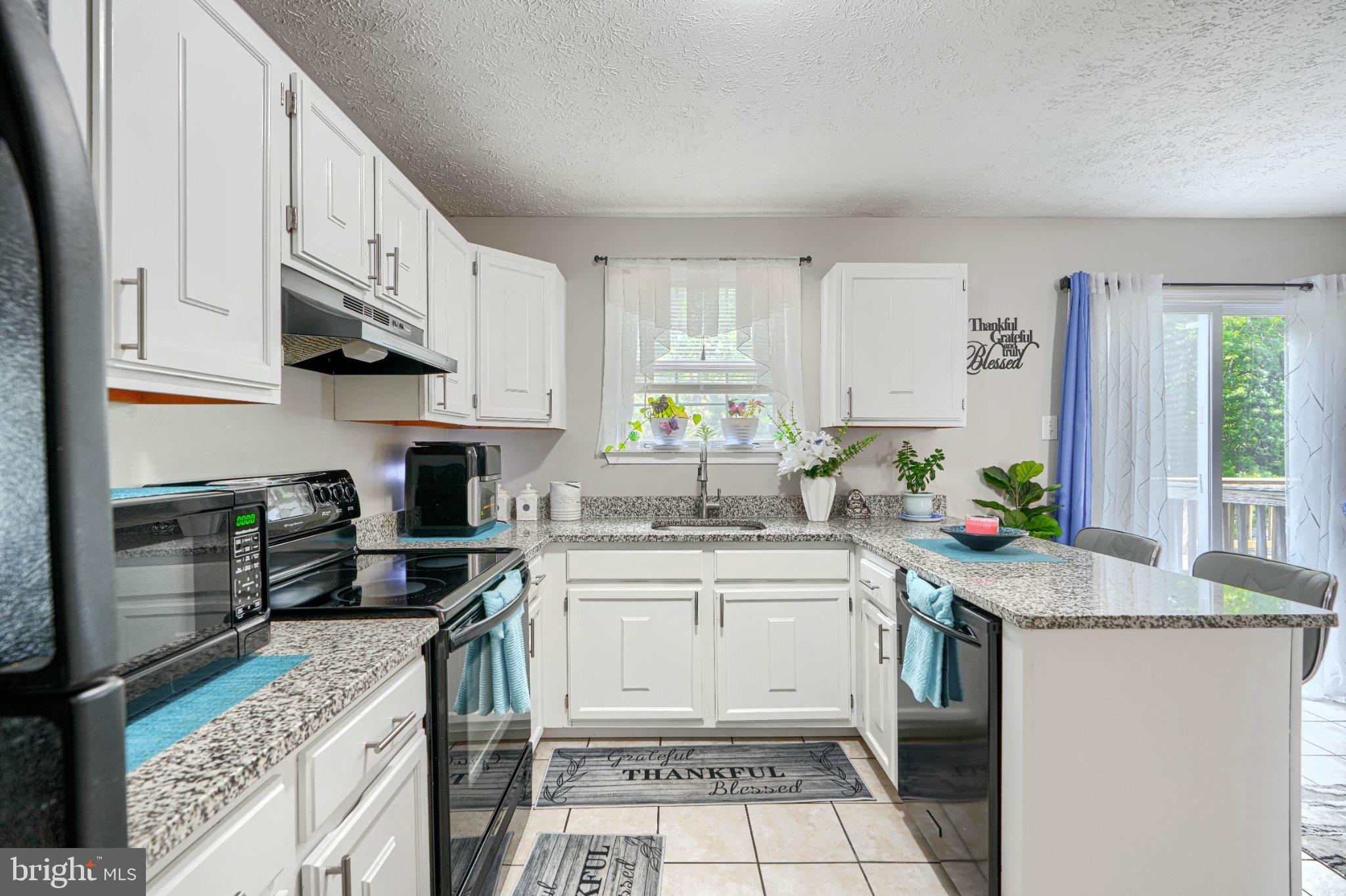 4067 Rustico Road Baltimore, MD 21220 - Photo 15 of 31 Bright and inviting kitchen space.