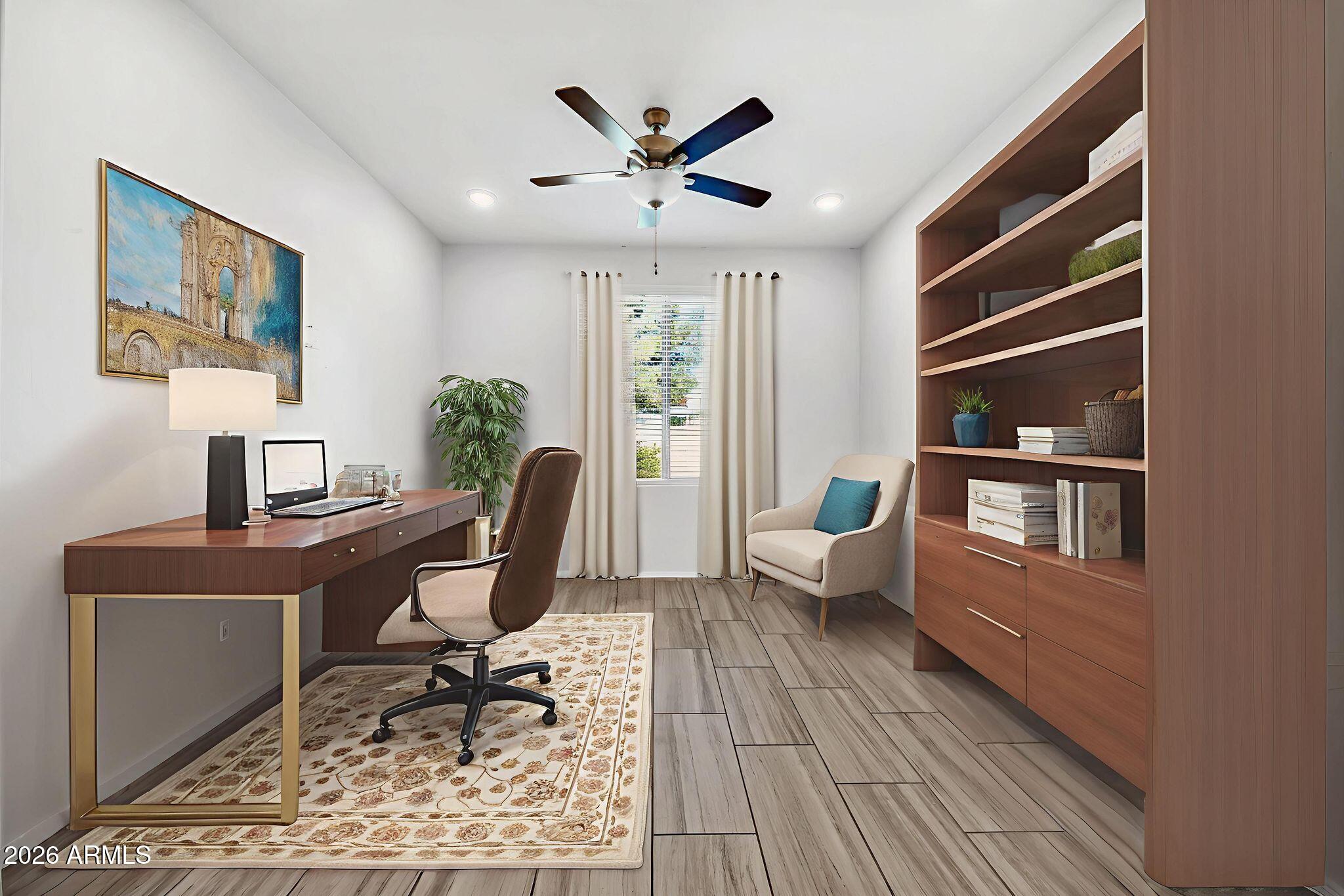 14384 West Hearn Road Surprise, AZ 85379 - Photo 20 of 63 a work room with furniture wooden floor and windows